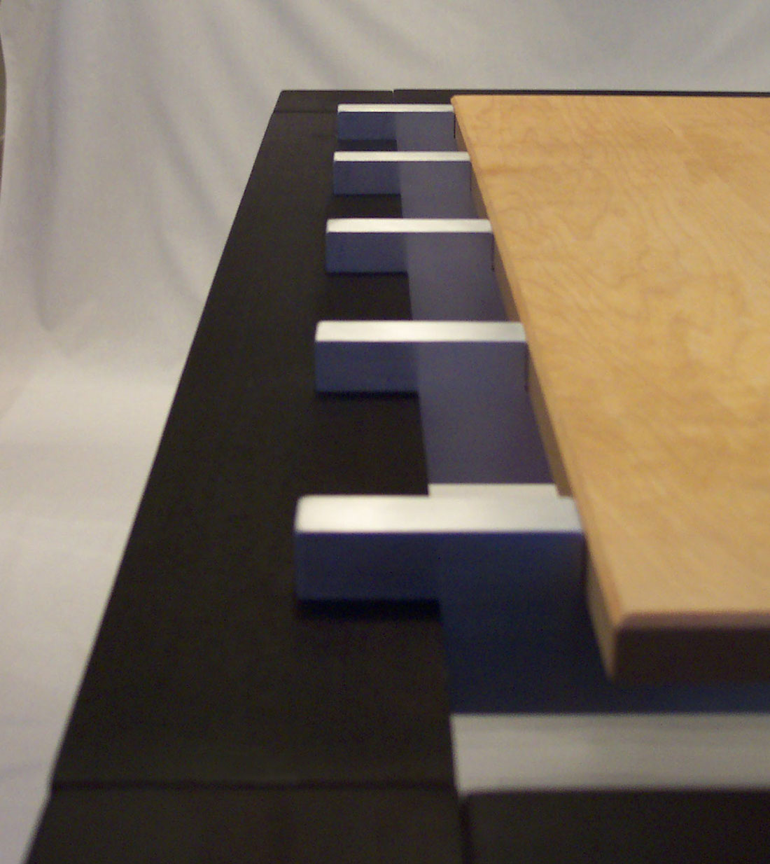 Detail view of aluminum beams holding table top